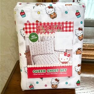 Hello Kitty Queen Sheet Set with holiday theme. White w/Pink, Red, blue accents.